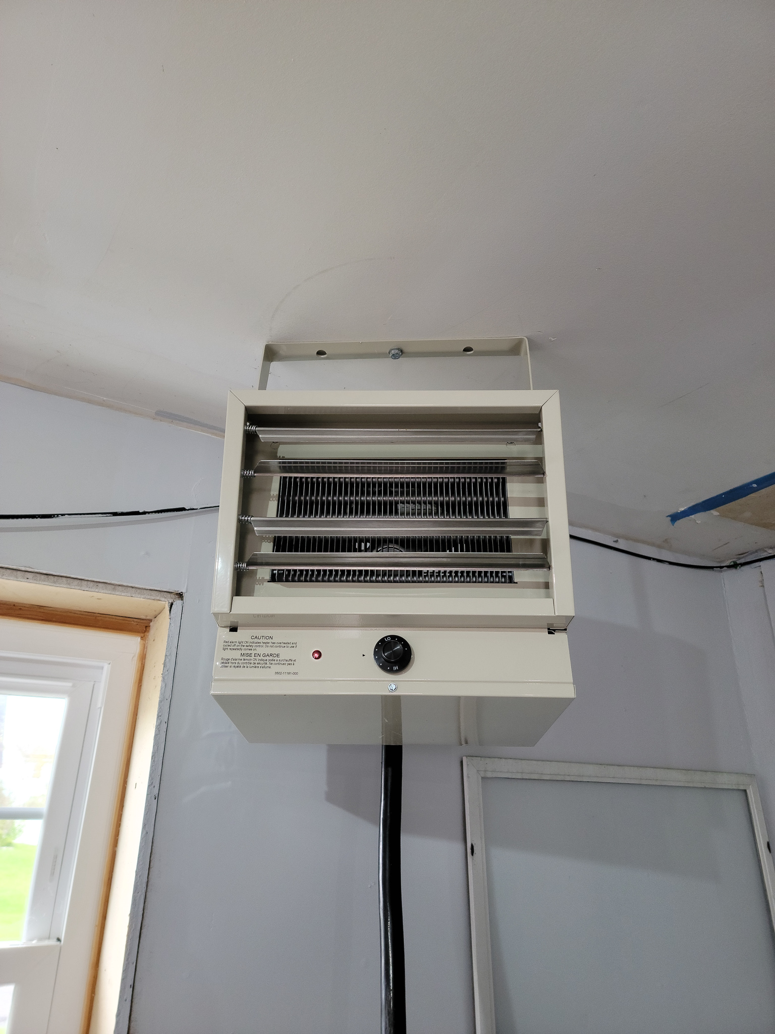 The Best Garage Heater Option mounted to a garage ceiling