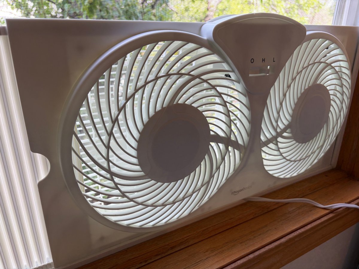 Amazon Basics Twin Window Fan installed during testing