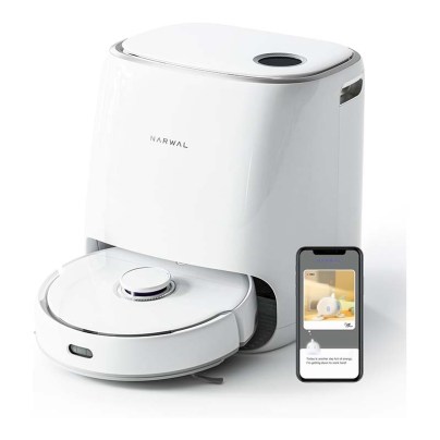 White Robot Vacuum and Mop in charging station next to smartphone on white background