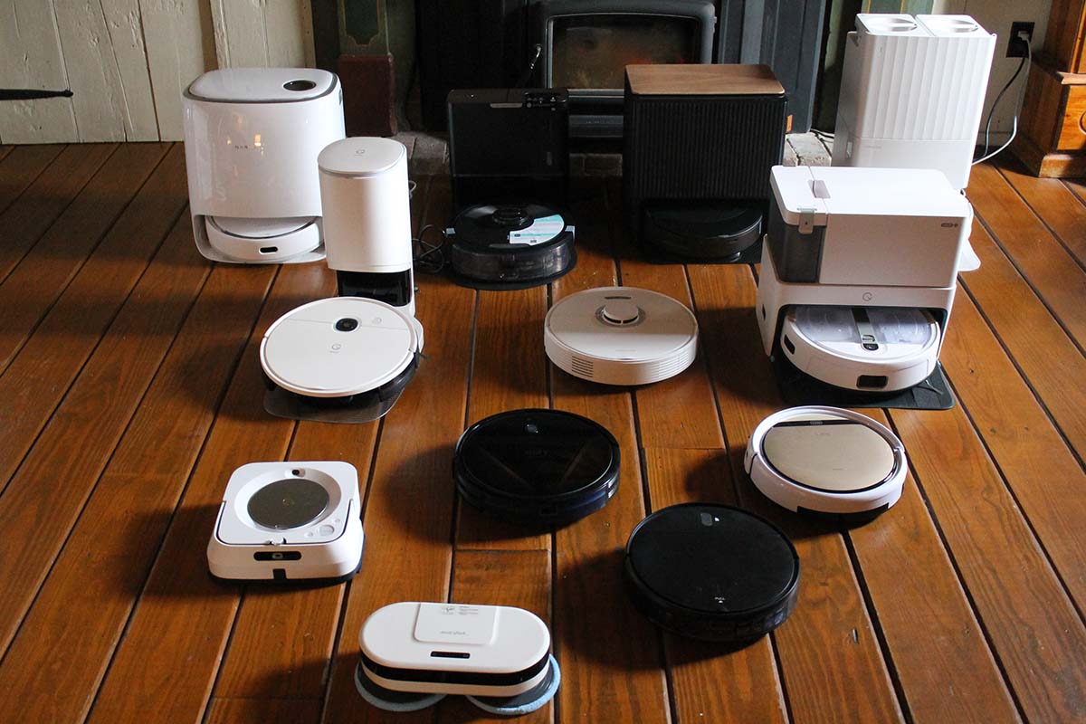 Several robot mops lined up on hardwood floor