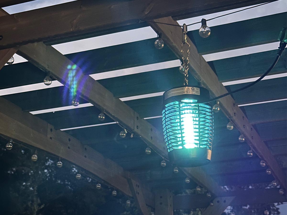 The best bug zapper option hanging from the rafters of a pergola