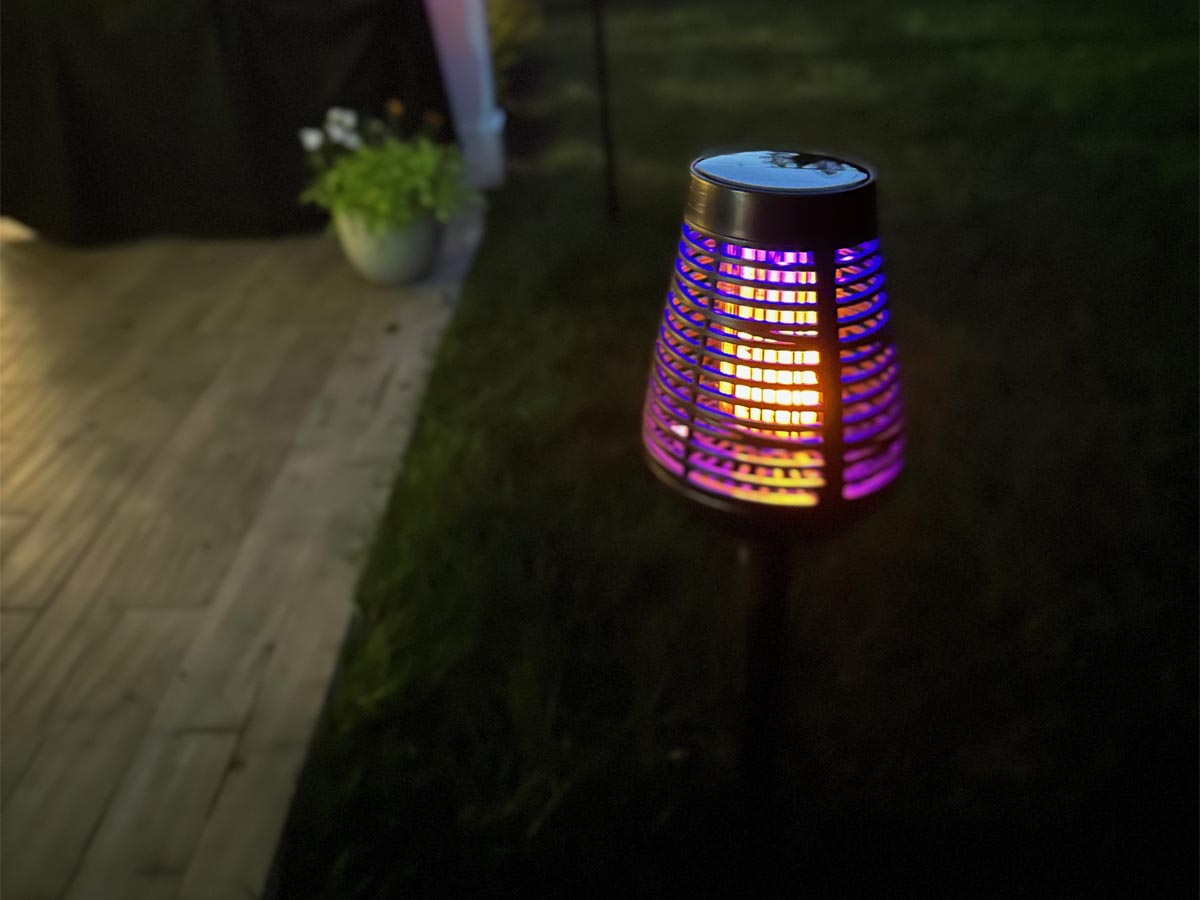 The best bug zapper option glowing next to a porch