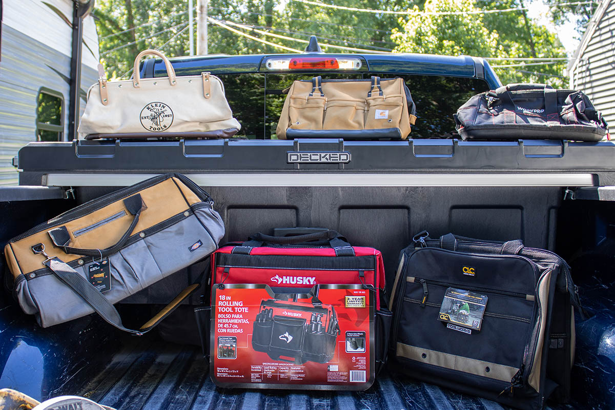 The 6 best tool bags for DIY and construction set up in the back of a truck.