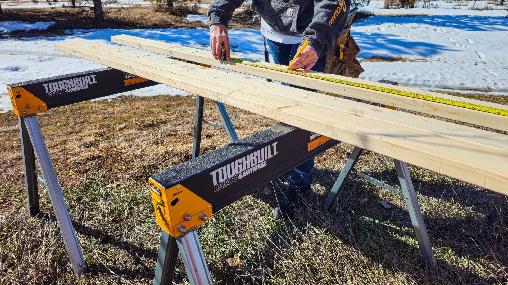 woman-measuring-wood-toughbuilt-sawhorses