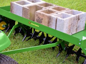 The John Deere lawn aerator in use during testing