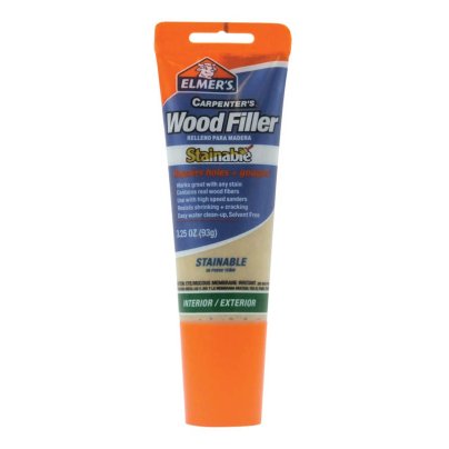 A blue and orange tube of Elmer’s E887Q Stainable Wood Filler on a white background.