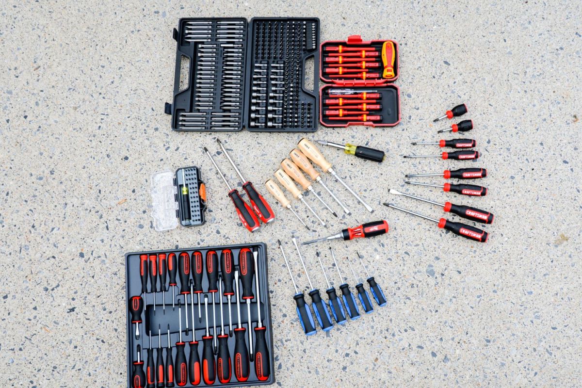 Several of the best screwdriver sets laid out together on a counter.