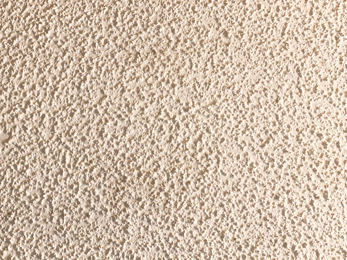 Closeup image of textured popcorn ceiling or wall.