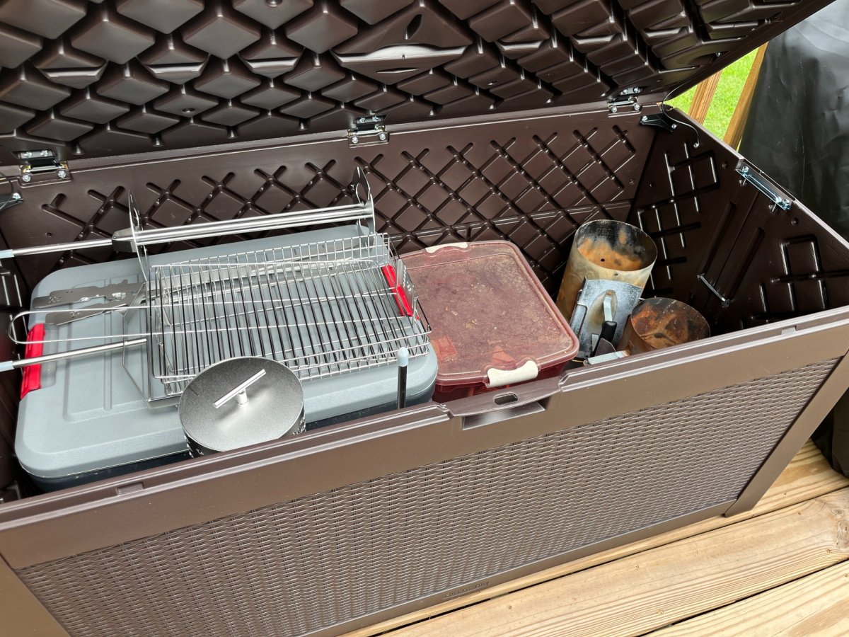 One of the best Deck Boxes, the Rubbermaid Extra-Large 134-Gallon Deck Box open to show its contents during testing