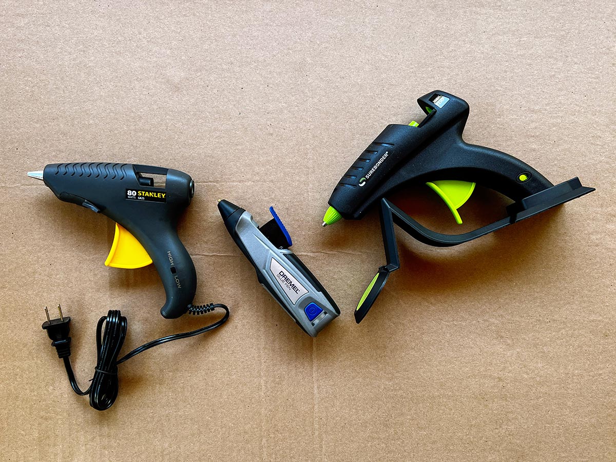 The best glue gun options grouped together and placed on cardboard