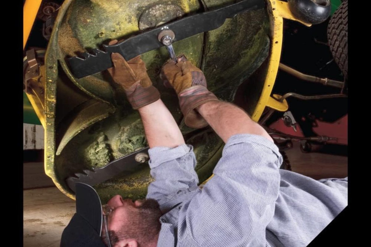 a person working on a mulching blade