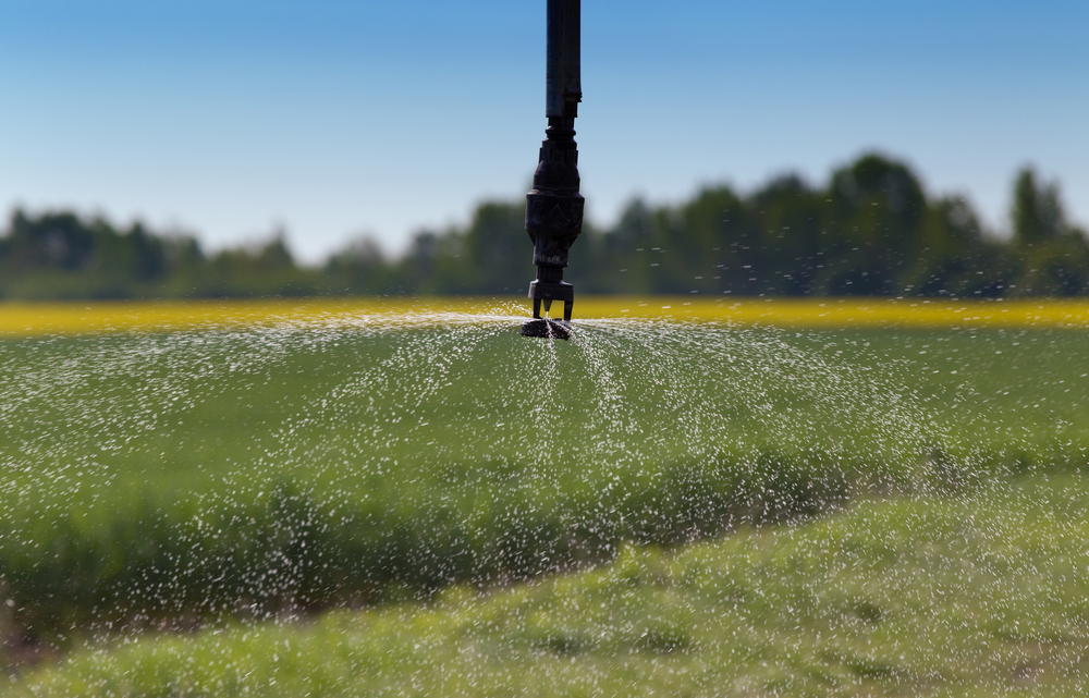 The best drip irrigation system option spraying water over a field