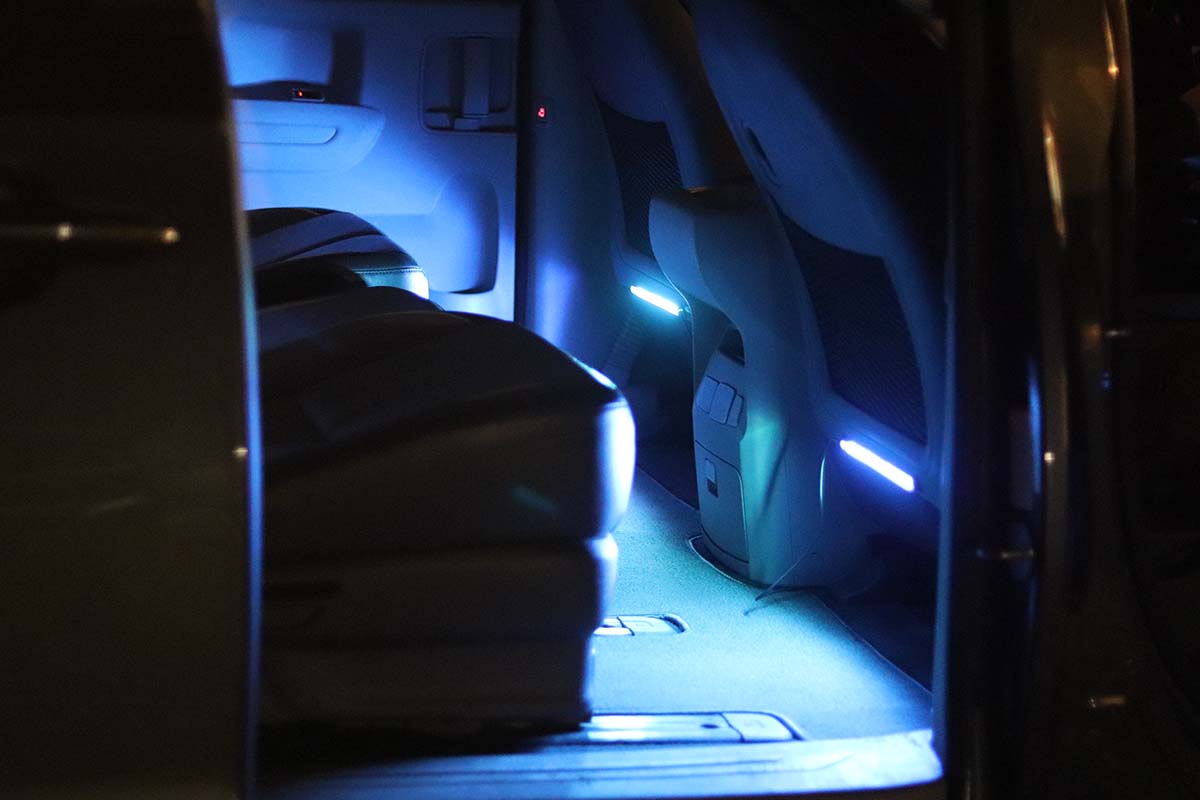 The best LED light options installed on the backs of the front seats in a car.