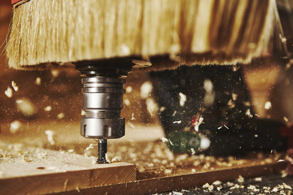 The best router bit in use drilling into a piece of wood.