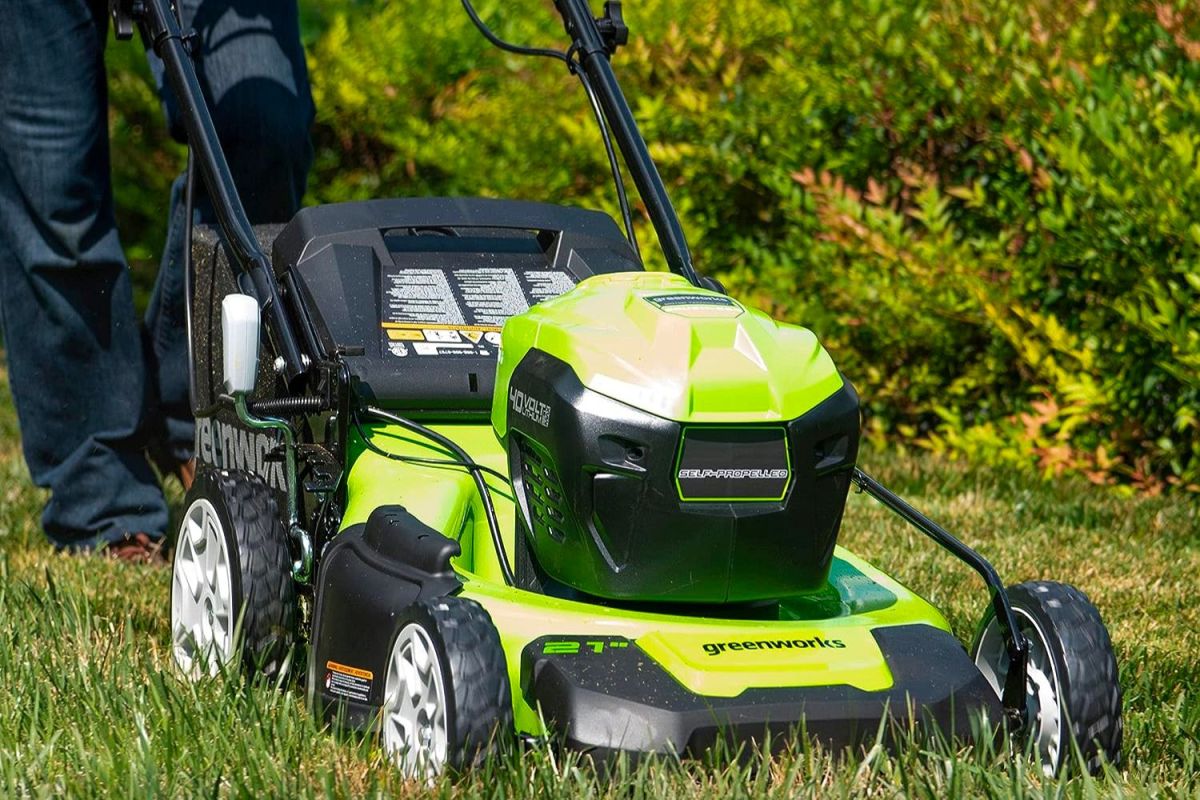 A close-up of the best self-propelled lawn mower option in use mowing a lawn