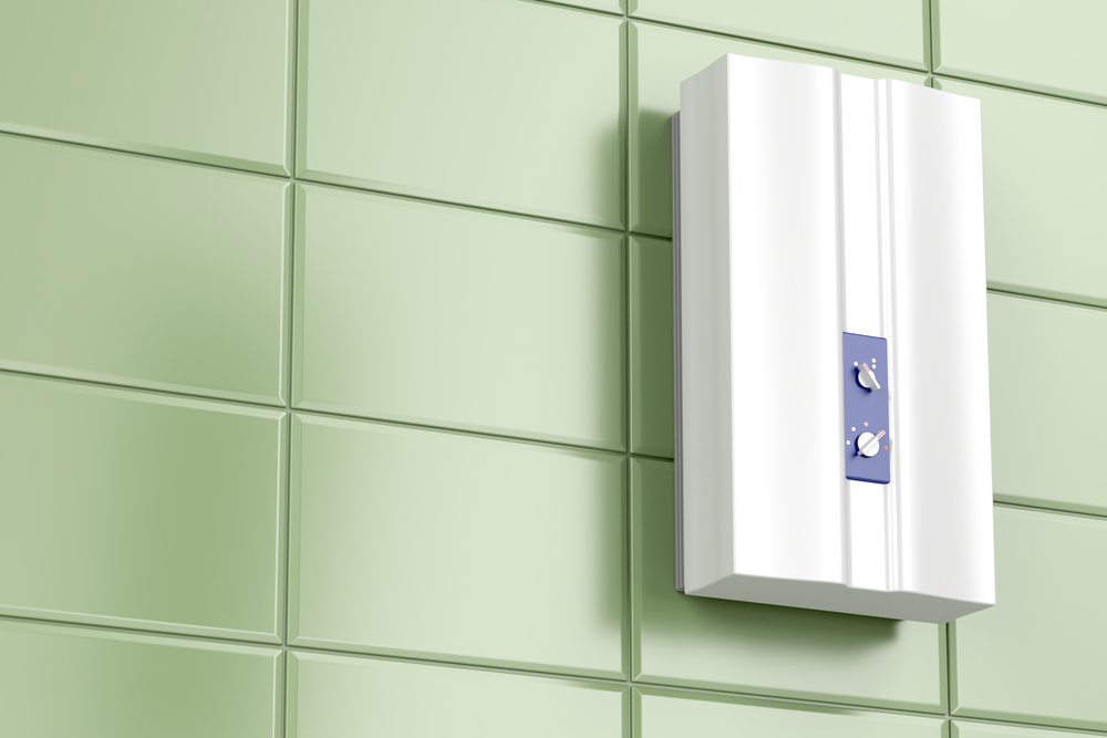 The Best Tankless Gas Water Heater installed on a green tiled wall.
