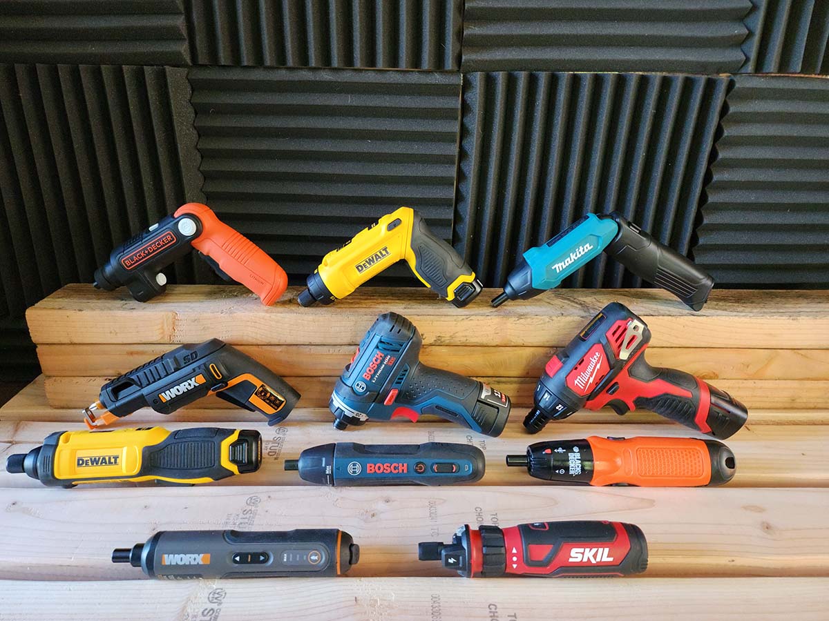 A group of the best electric screwdriver options grouped together on a small wooden riser prior to testing.