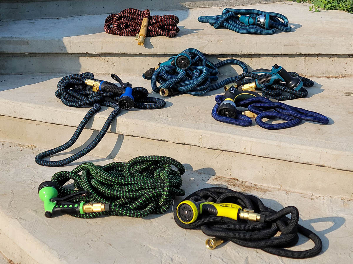 The Best Expandable Hoses Options laid out as group on cement stairs