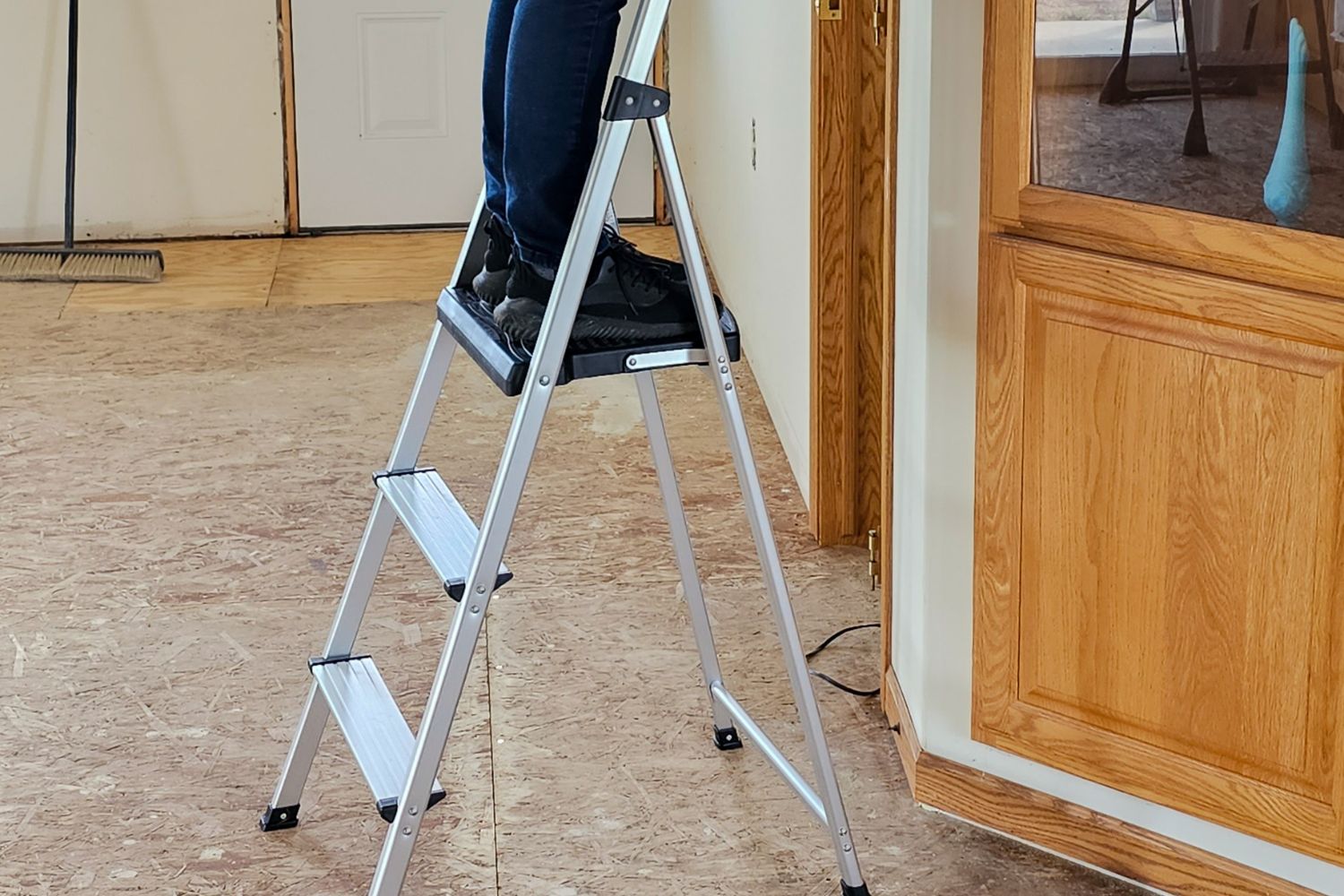 A person using the best ladder option during home renovation