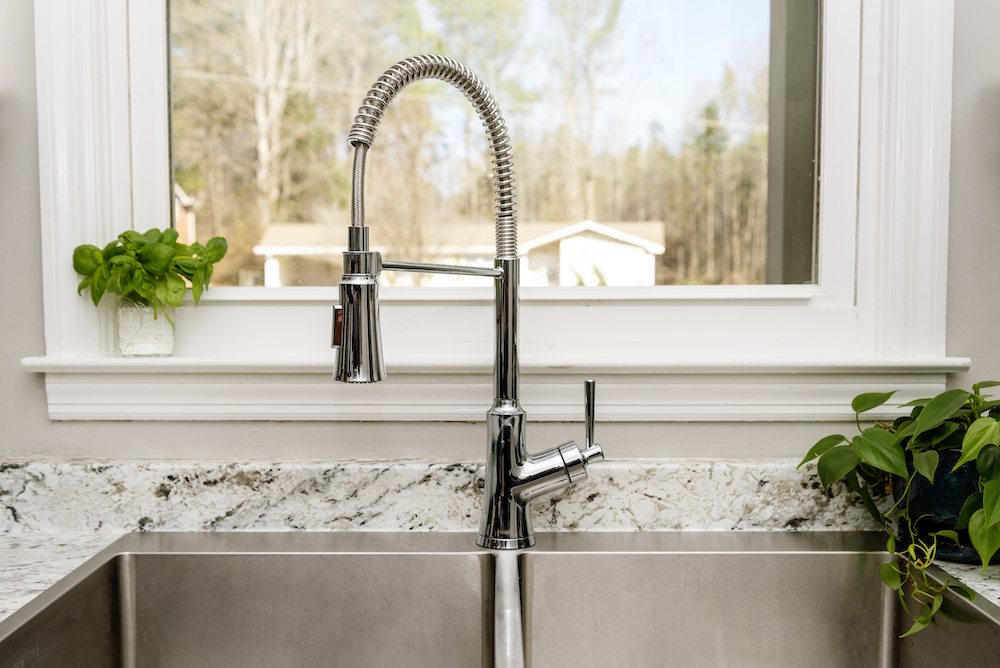 The best kitchen faucet option installed over a farmhouse kitchen sink