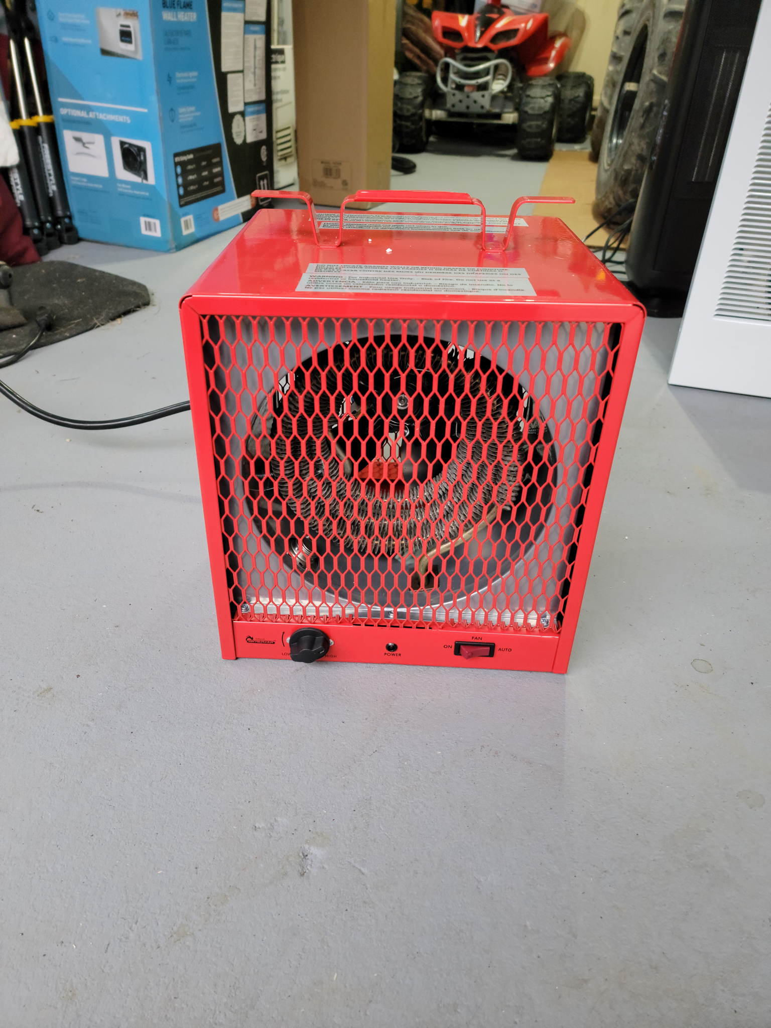 The Dr. Infrared Heater DR-988 Portable Industrial Heater on a garage floor before testing.