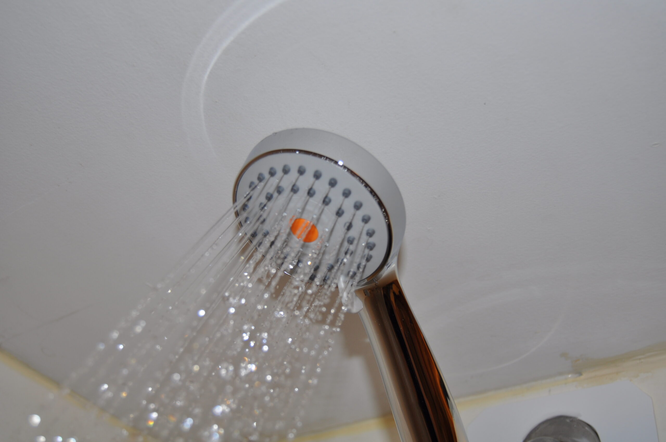 TheHO2ME High-Pressure Handheld Shower Head in use during testing.
