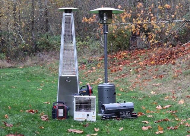 Six Non Electric Heaters on grass near woods