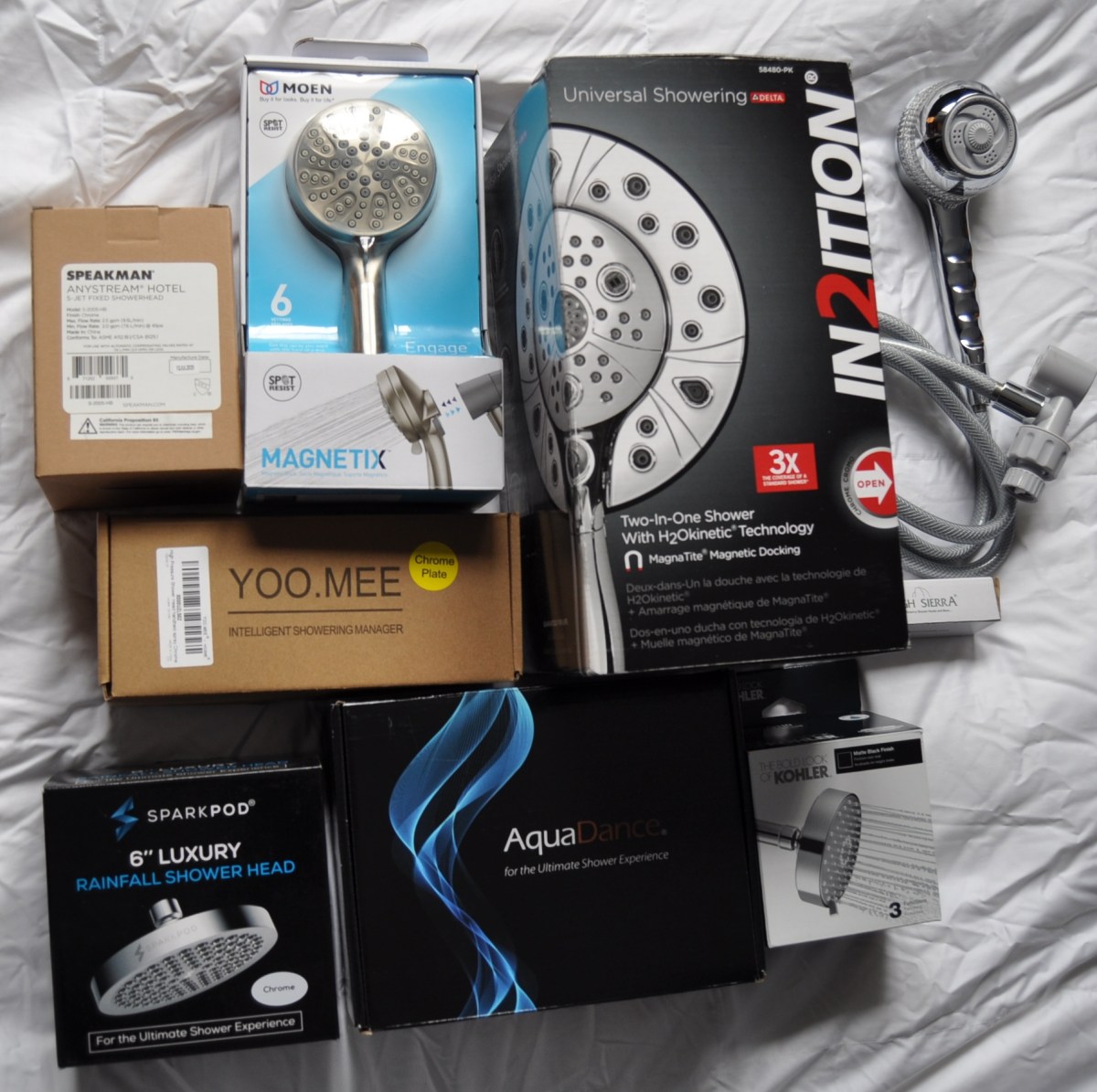 A group of the Best High-Pressure Shower Heads still in their boxes before testing.