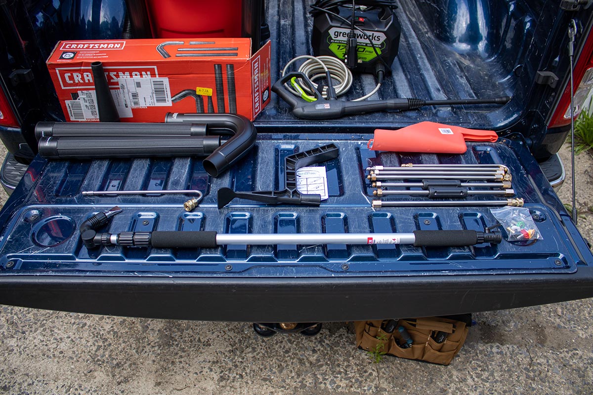 The Best Gutter Cleaner Options laid out together in a truck bed