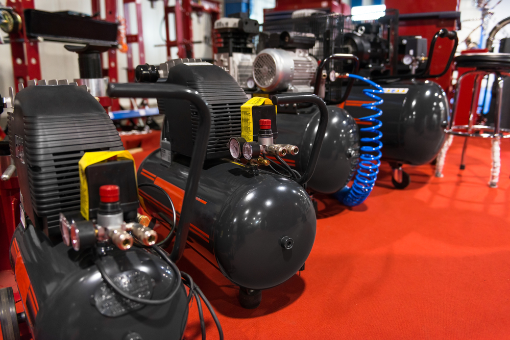 A group of the best portable air compressor options together on a red carpet