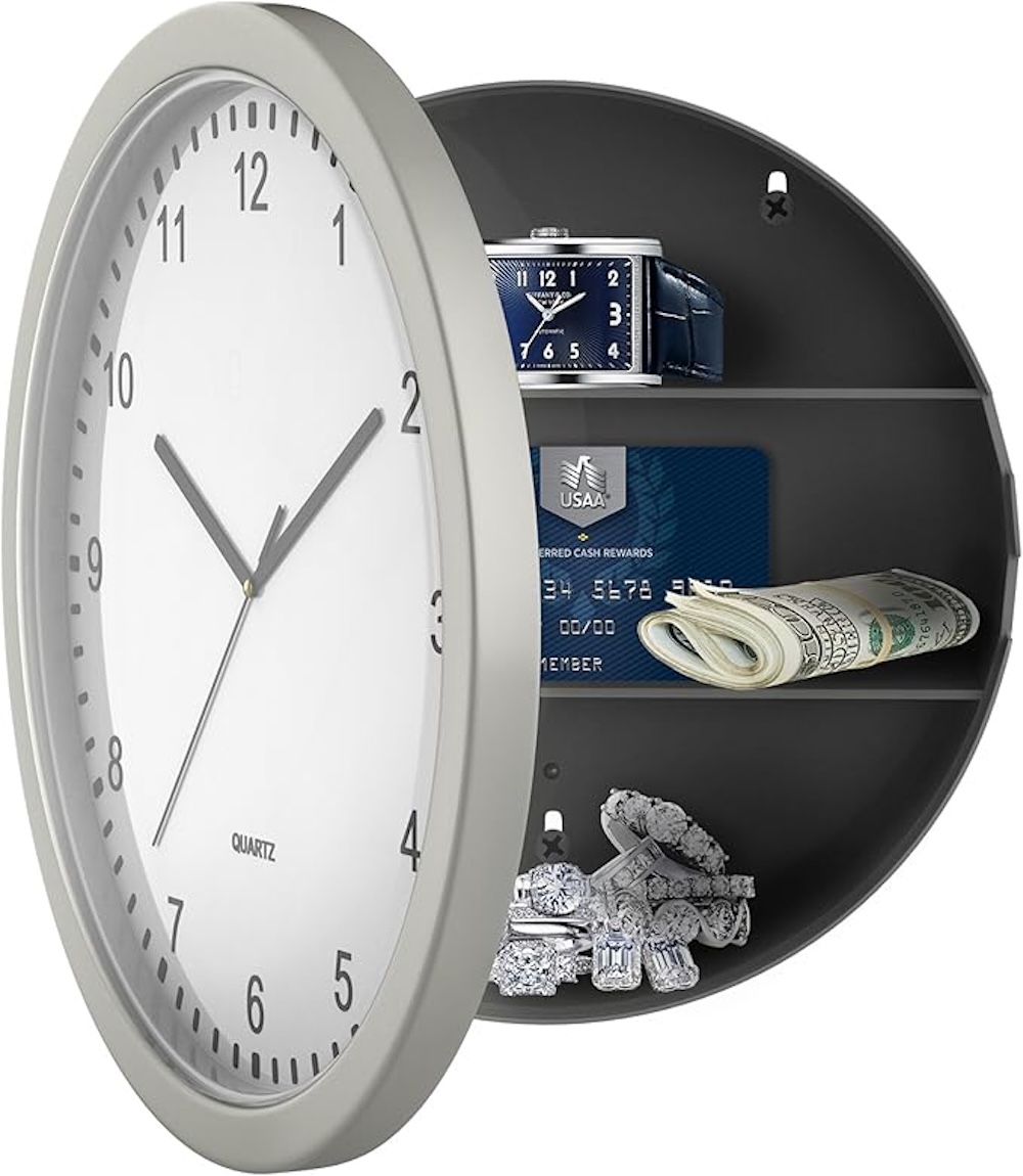 Round wall clock safe with silver trim open to reveal valuables inside.