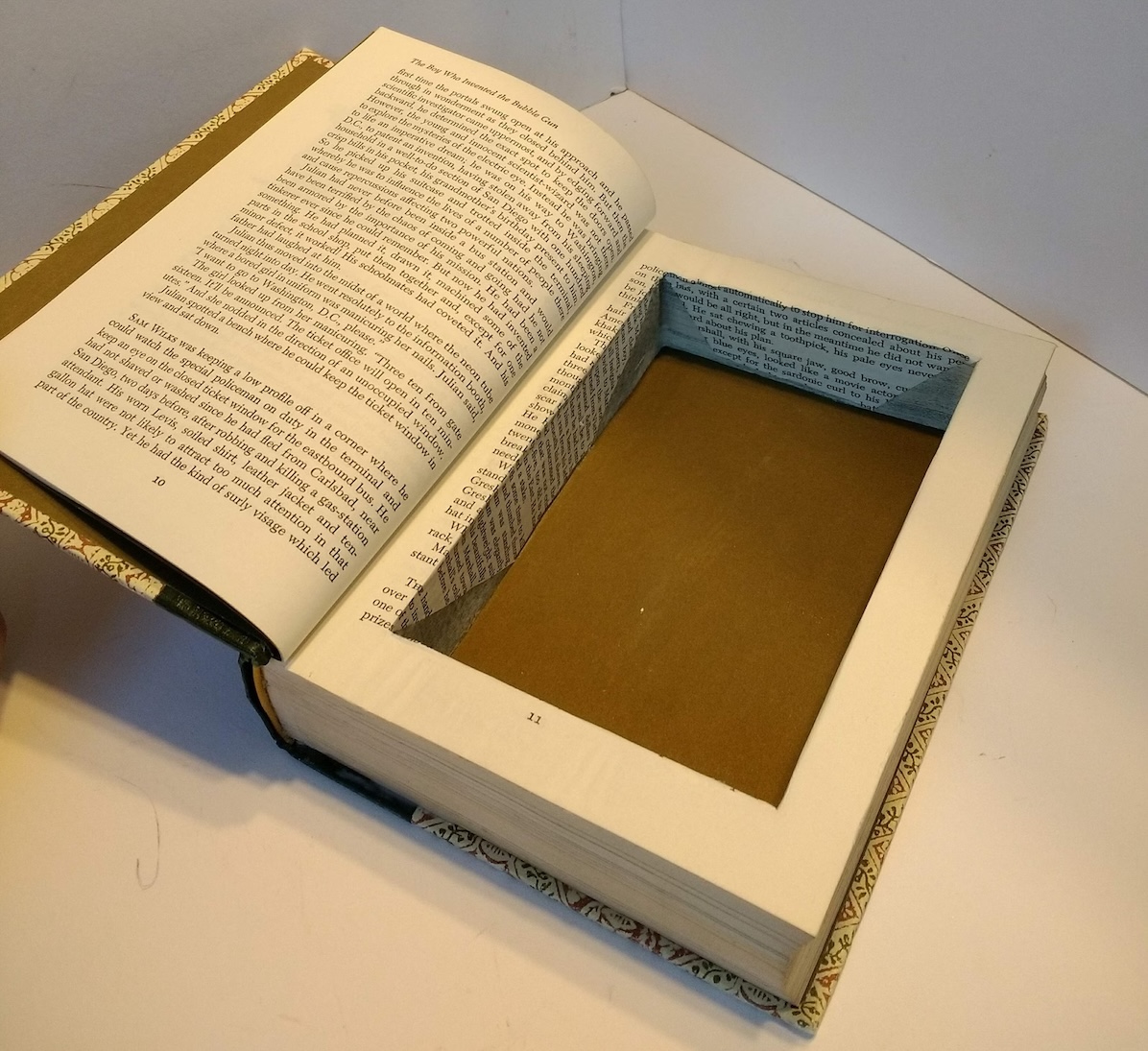 Book with inside cut out for a hiding spot.