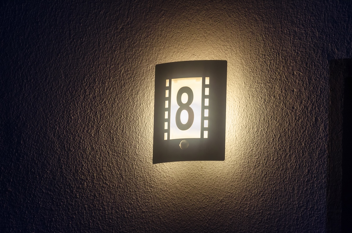 A house light illuminated with a warm light.