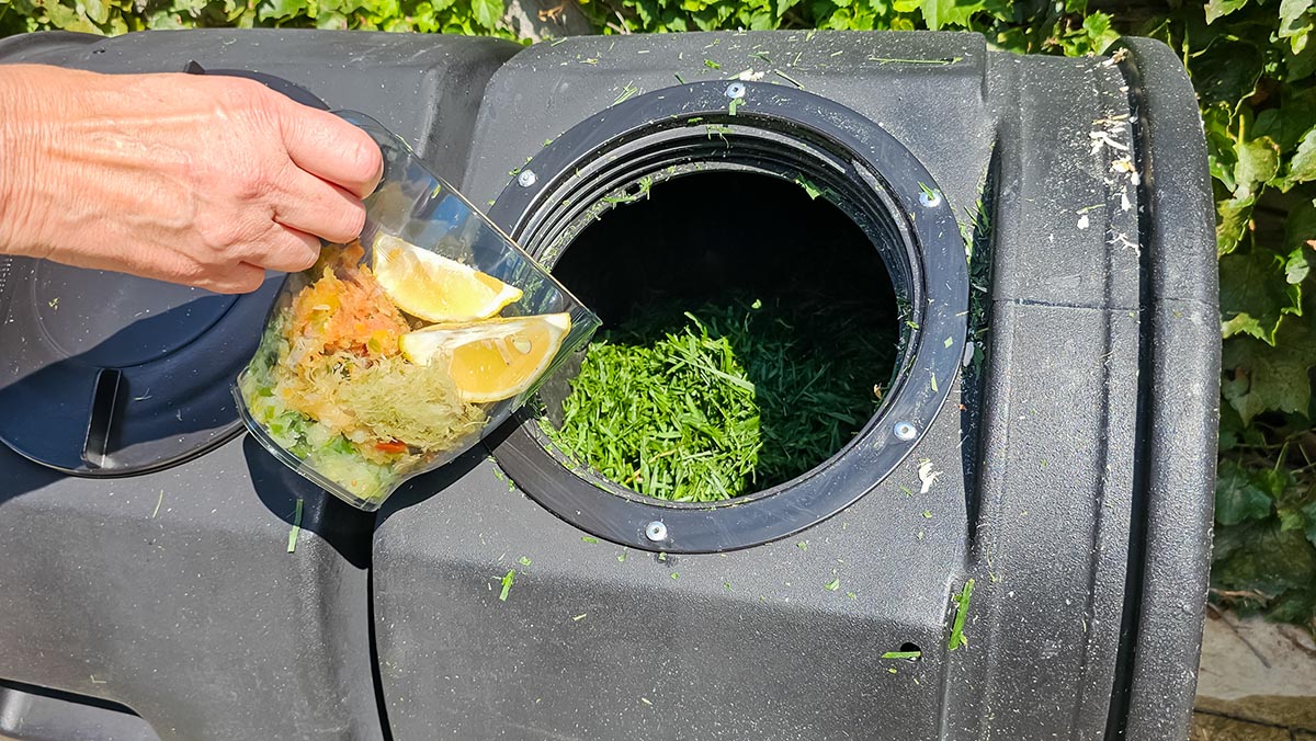 Adding scraps to the Good Ideas compost tumbler