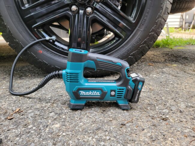 The best tire inflator option on the ground next to a car tire