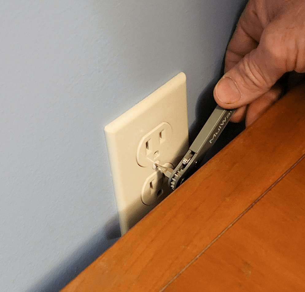Ratcheting screwdriver in use to replace socket