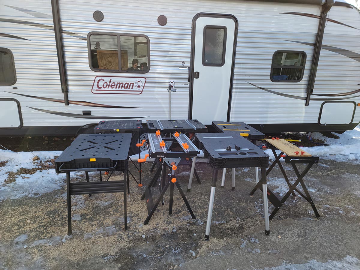 A group of the best portable workbenches grouped together by an RV before testing.