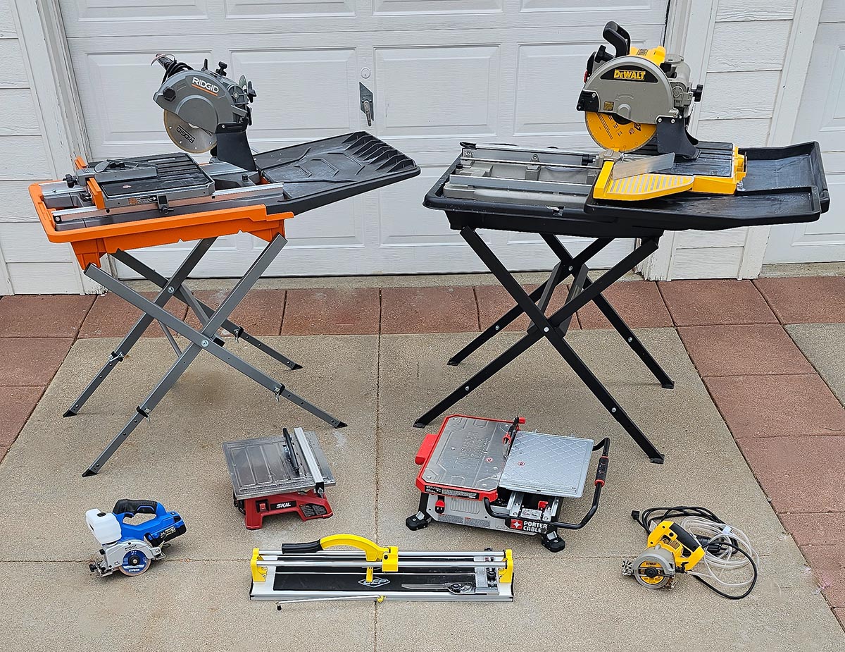 A group of the best tile saw options grouped together in on a driveway