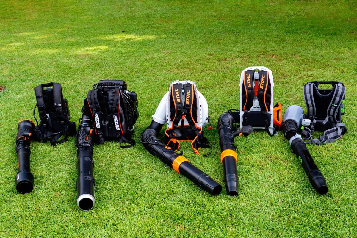 A group of the best backpack leaf blower options sitting together on green grass