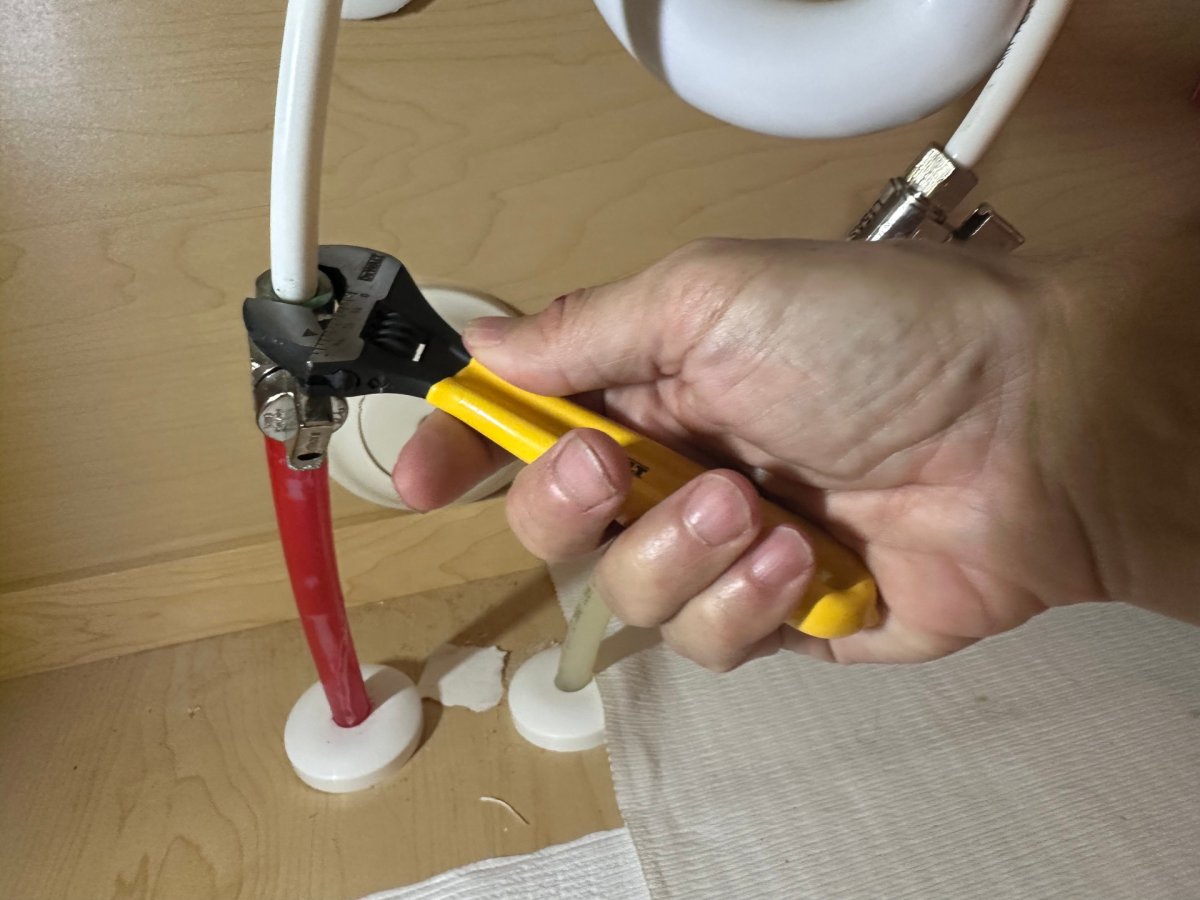 A person using one of the best adjustable wrenches at home