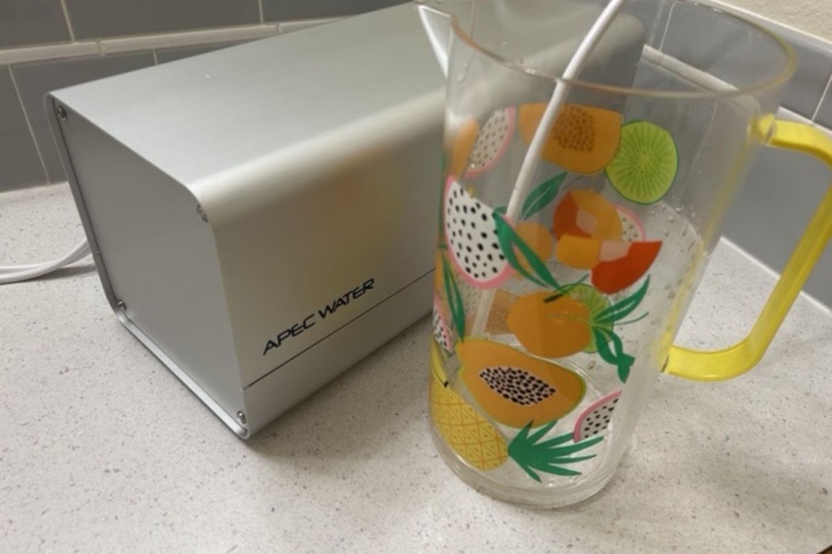 Apec Water Portable RO Countertop Filter System filtering into a pitcher