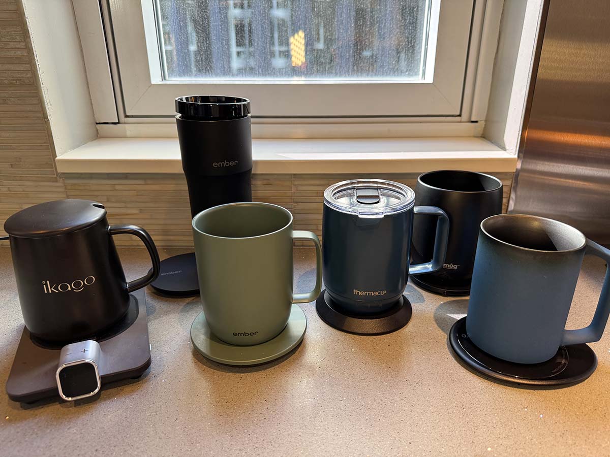 A group of the best mug warmers together on a kitchen counter before testing.
