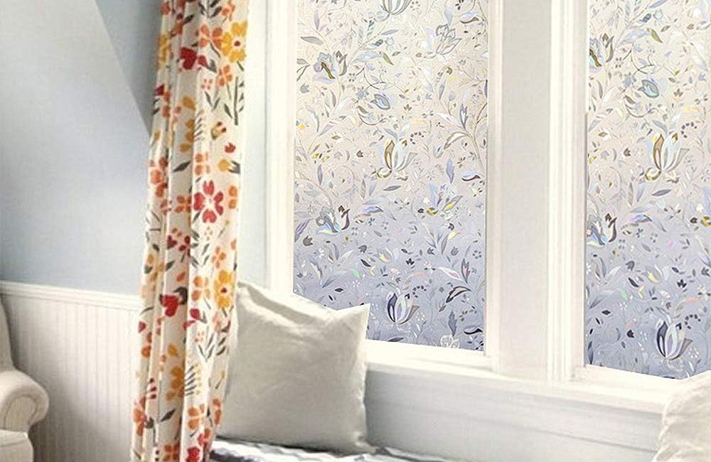 The best window film installed on a large living room window to provide privacy for a window seat.