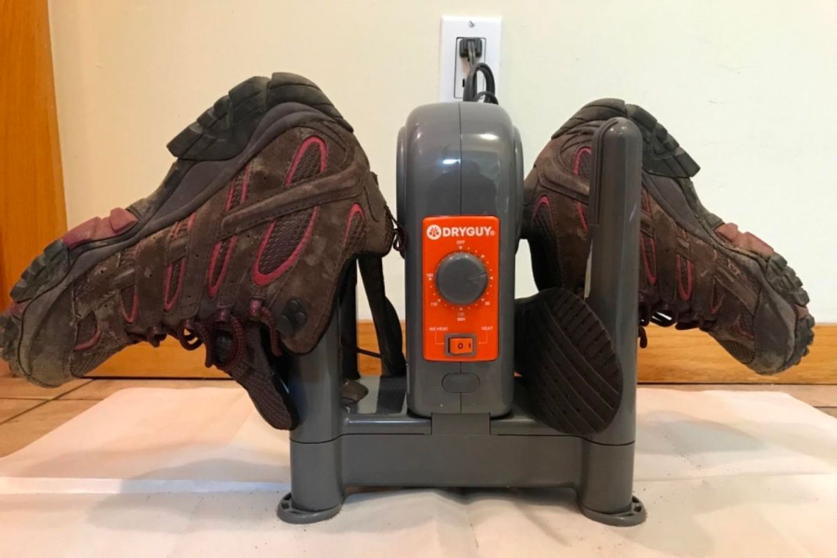 The Best Boot Dryers Option set up on a tile floor and turned on to dry a pair of boots.