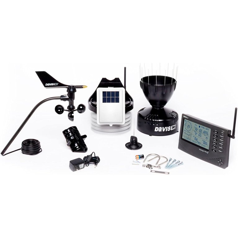  The Davis Instruments 6152 Vantage Pro2 Weather Station and its included parts on a white background.
