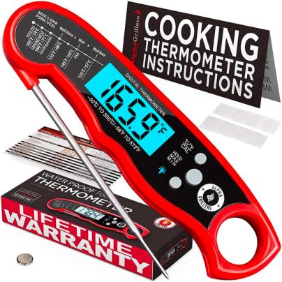 The Alpha Grillers Instant-Read Meat Thermometer on a white background with included packaging materials.