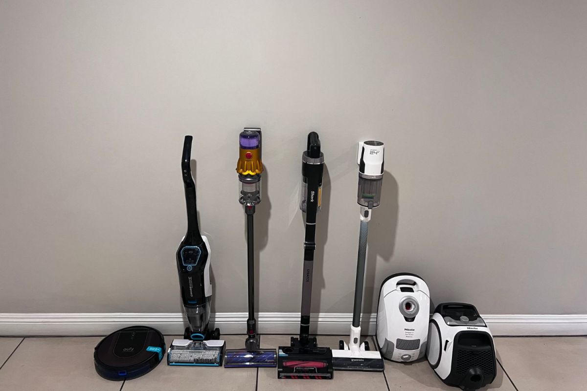 A group of the best vacuums for tile floors grouped together on a tile floor before testing.