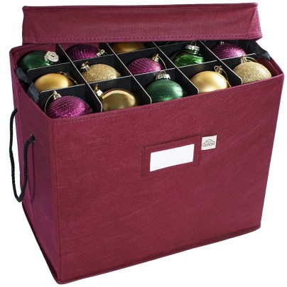 The 612 Vermont Christmas Ornament Storage Box with its lid slightly askew to reveal a set of stored ornaments.