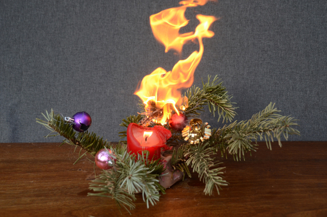 holiday candle on fire