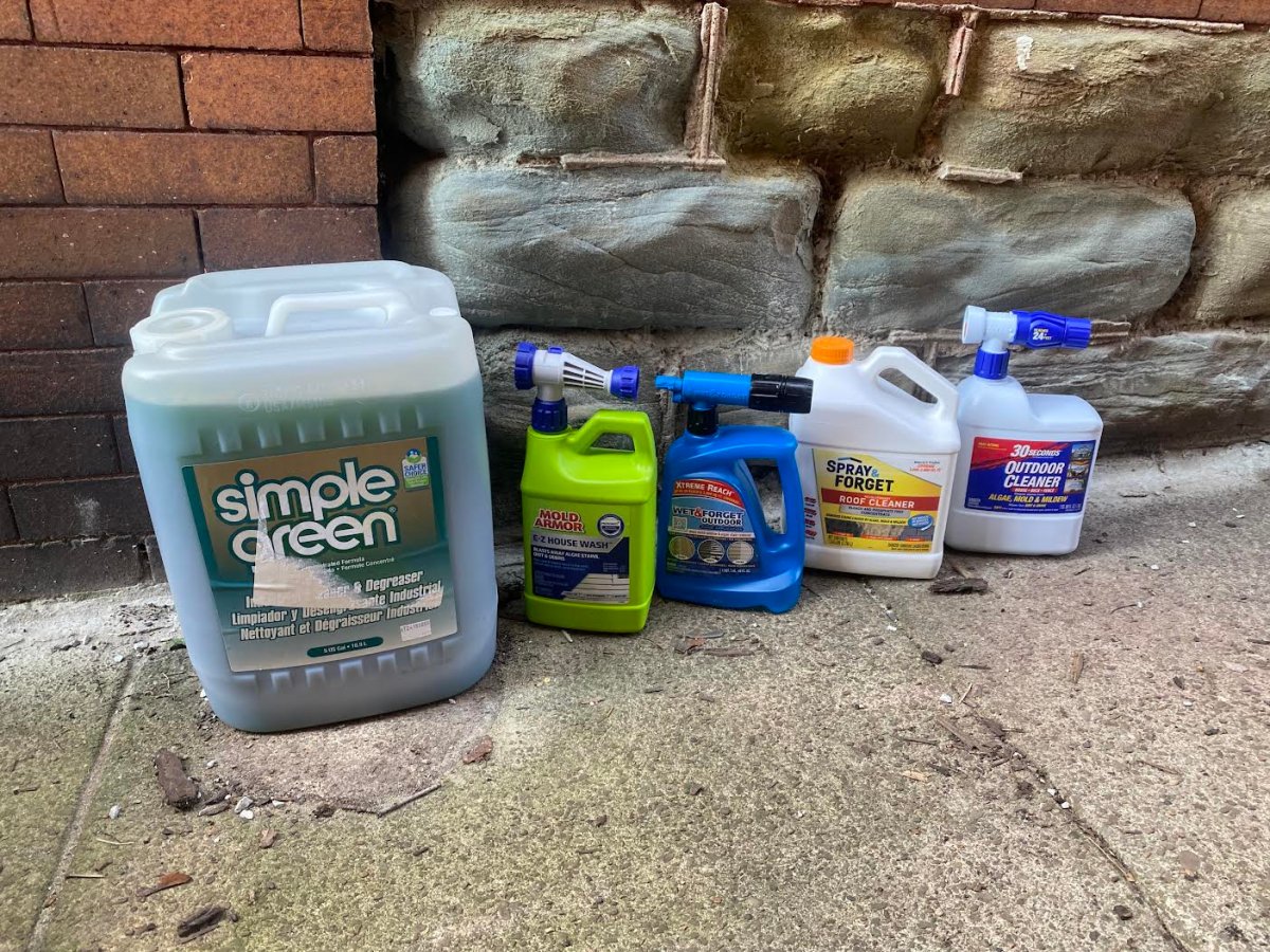selection of best roof cleaners packages laid out on the floor
